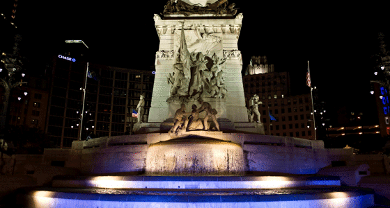 A close-up of a sculpture from the Soldiers and Sailors Monument at night with spot lighting.